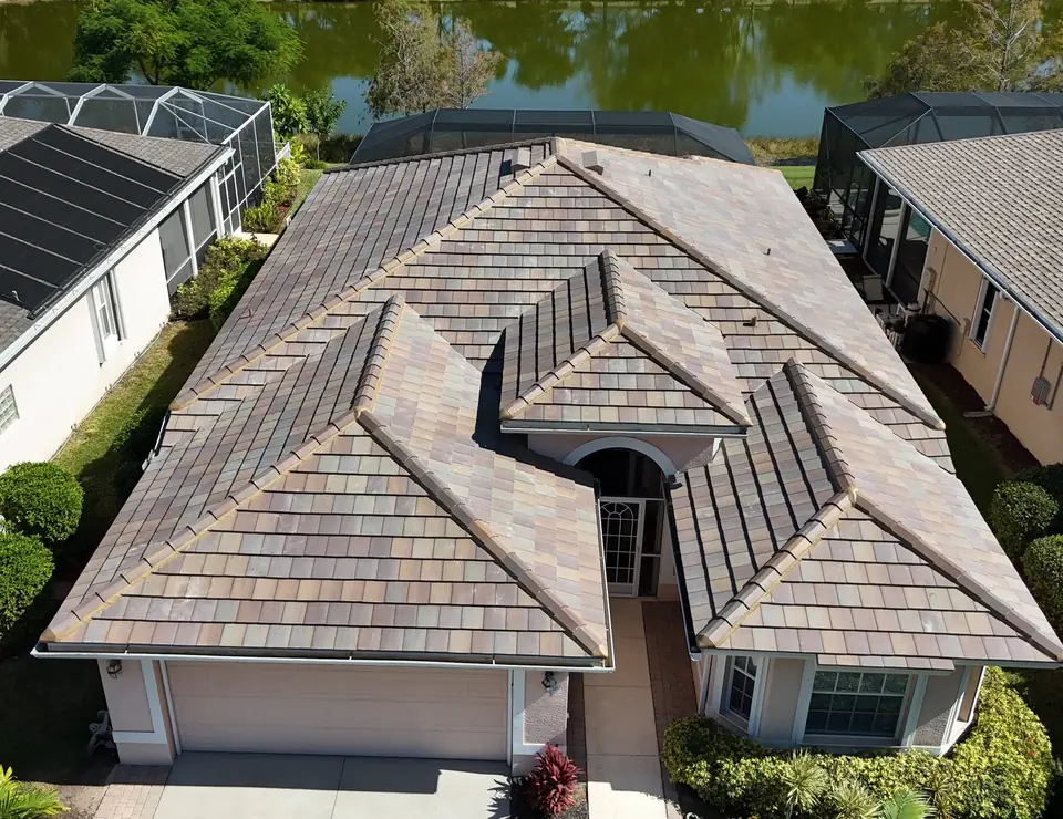 Concrete tile re-roof on a lakefront home by Providential